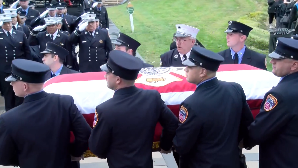 NYC paramedic casket carried by honor guard