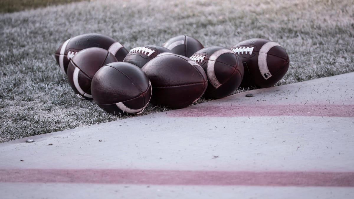 Group of footballs on field