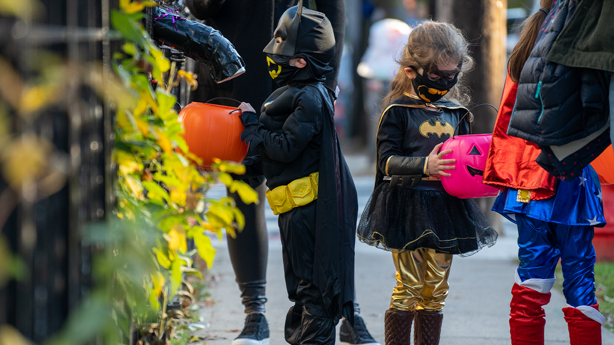 Kids out trick-or-treating for Halloween