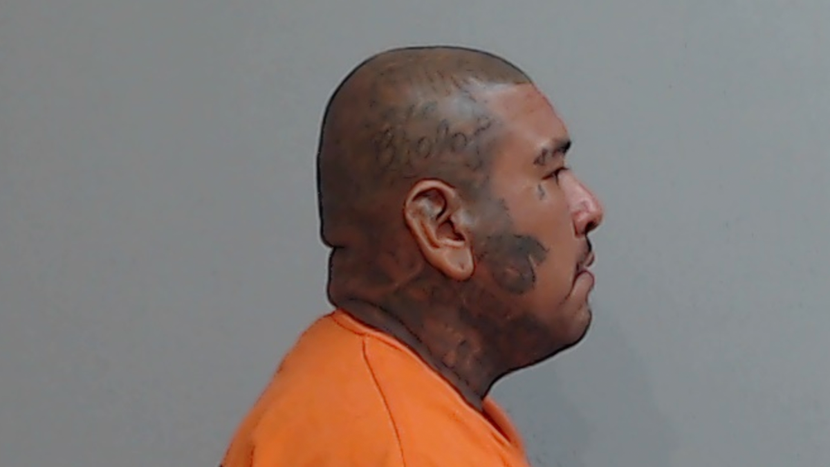 Side mugshot of Carlos Garcia