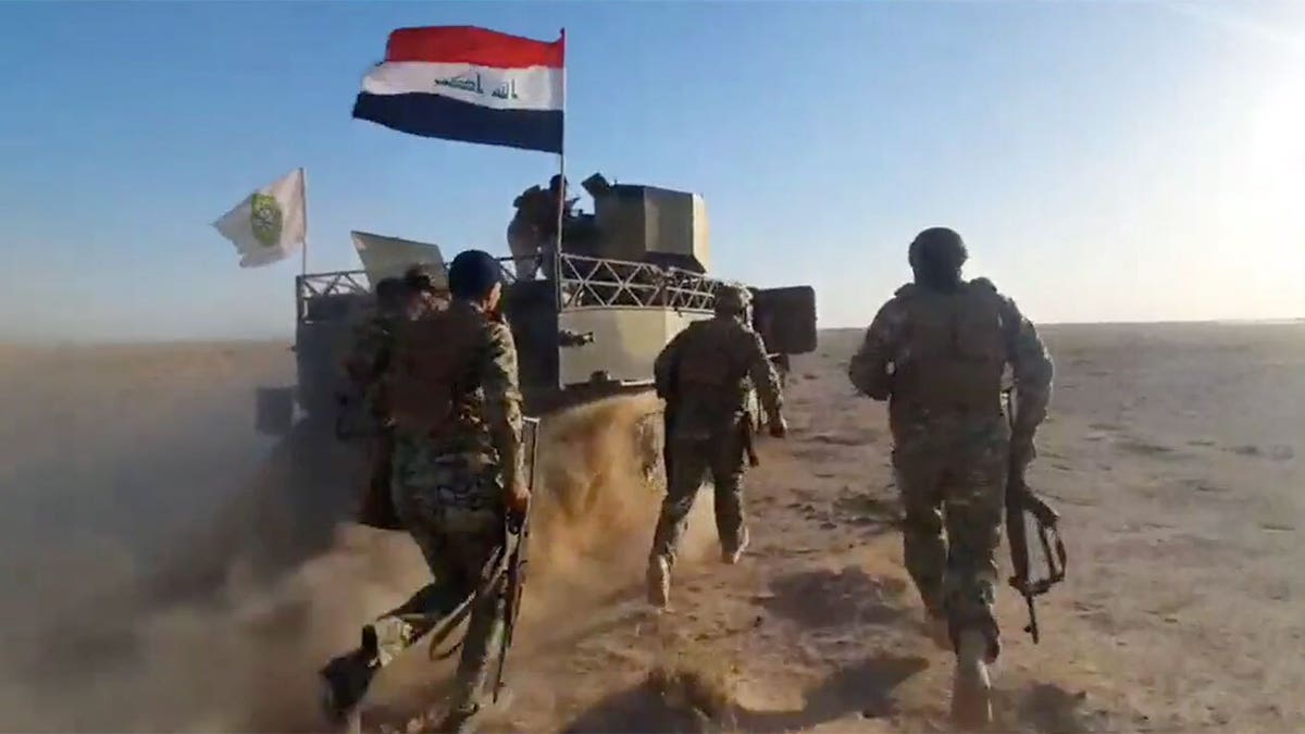 Iraqi Public Mobilization Forces during a battle with an ISIS cell in Iraq.
