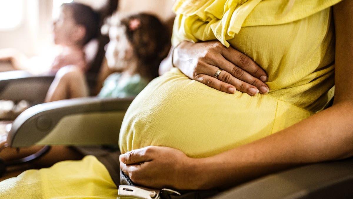 Pregnant woman on plane