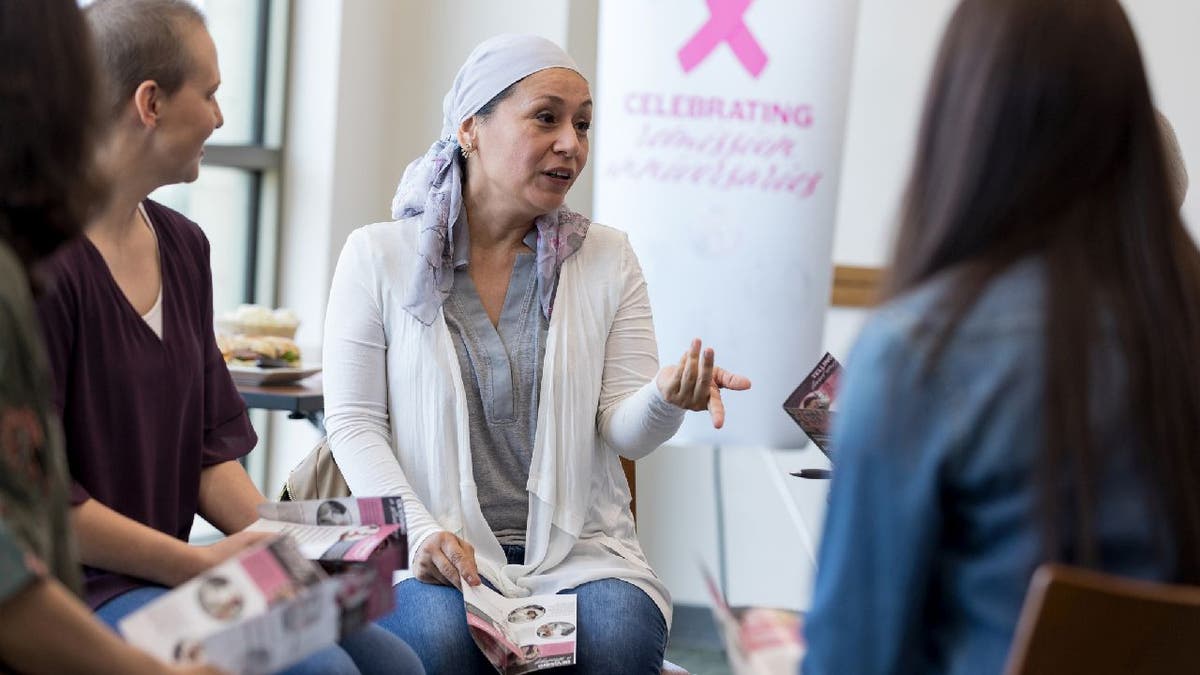 Women talk during breast cancer meeting