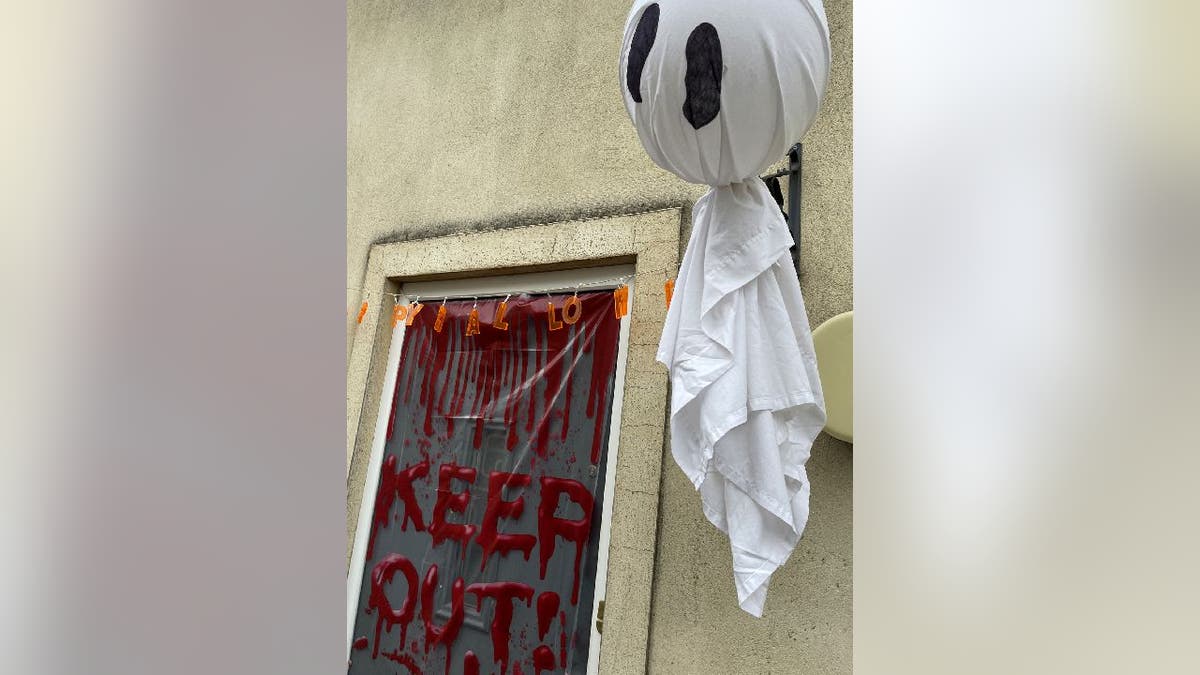 Halloween-themed keep out sign on door