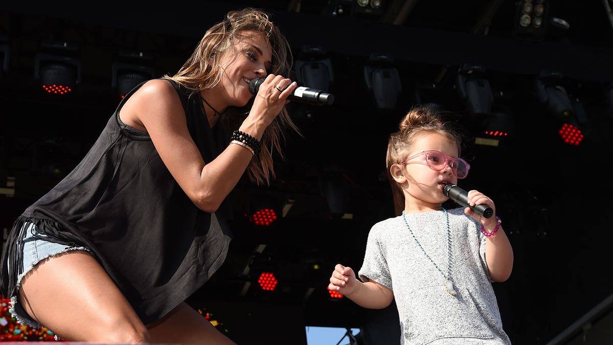 Jana Kramer and her daughter Jolie Rae Caussin on stage