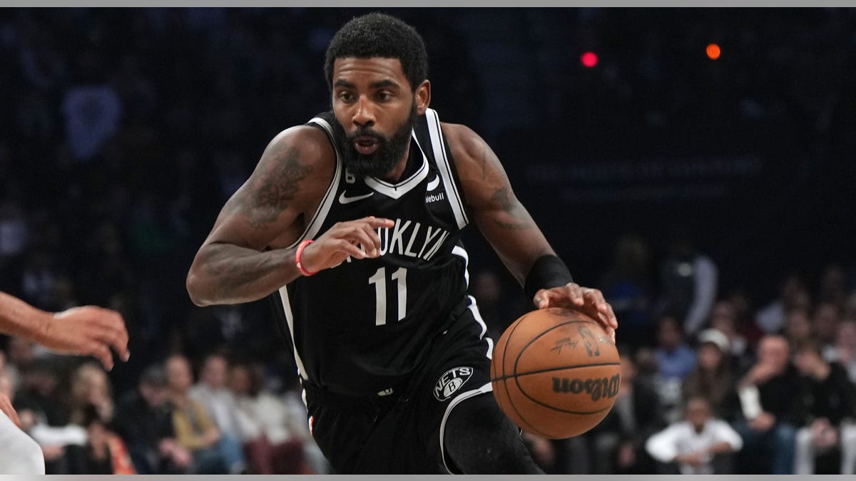 Kyrie Irving drives to basket