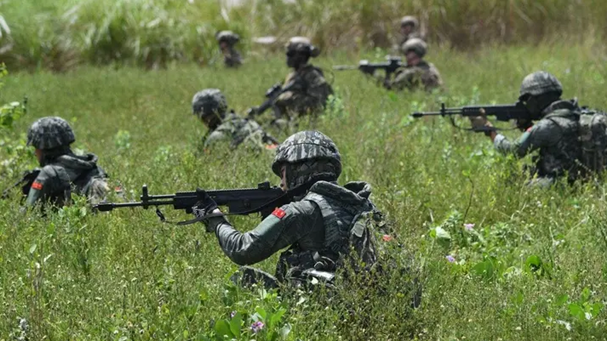 South Korean and U.S. Marines take positions during a joint amphibious landing exercise with their Filipino counterparts on a beach facing the South China Sea in San Antonio town, Zambales province, Oct. 7, 2022.  (Ted Aljibe/AFP via Getty Images)