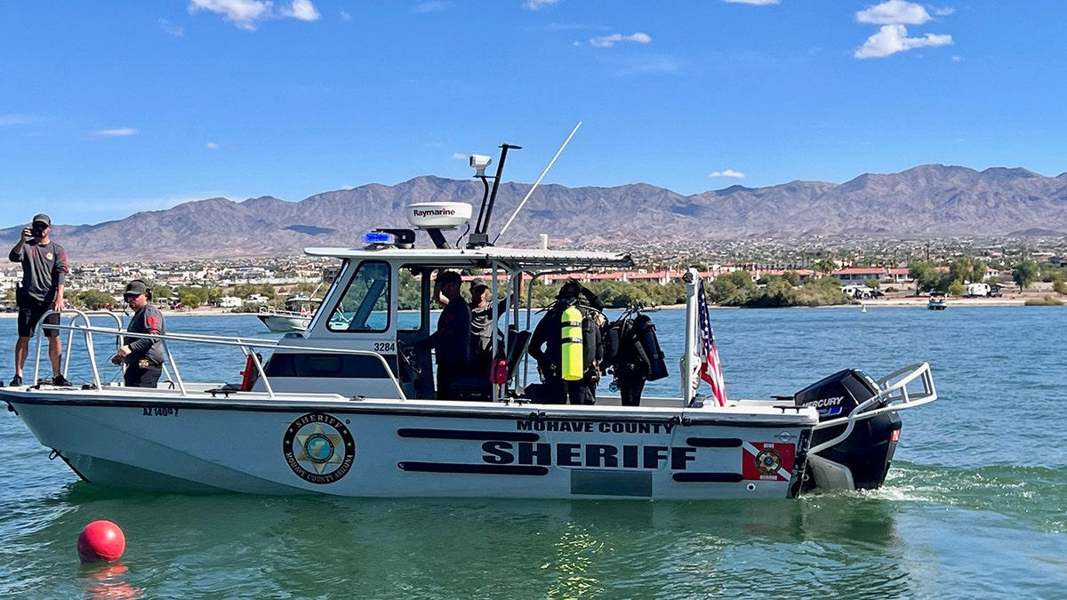 deputies and rescue divers aboard boat on lake havasu