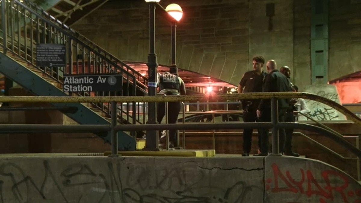 NYPD officers at Brooklyn subway station slashing scene