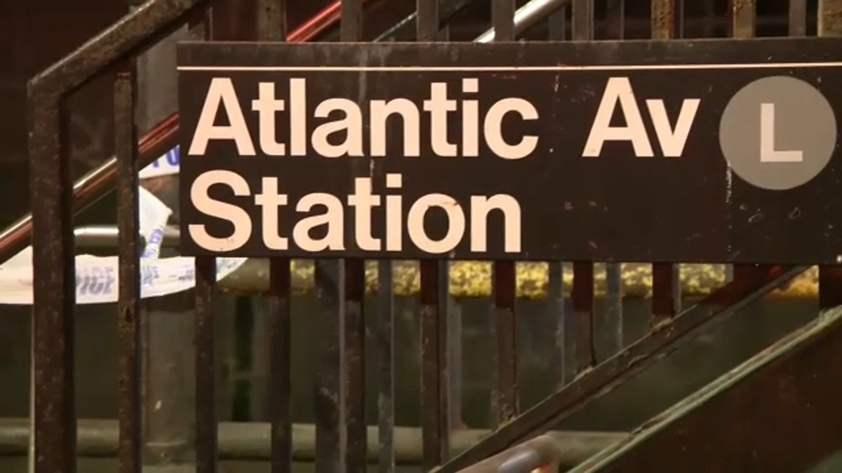 Atlantic Avenue subway station sign with crime scene tape