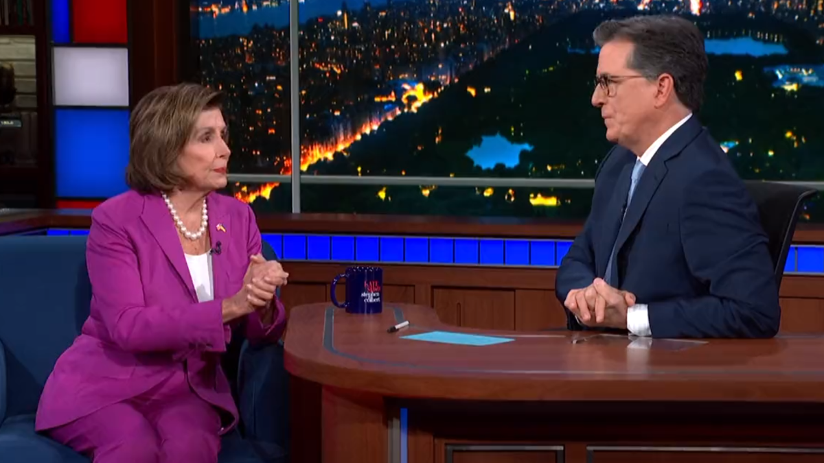 Nancy Pelosi speaking with Stephen Colbert