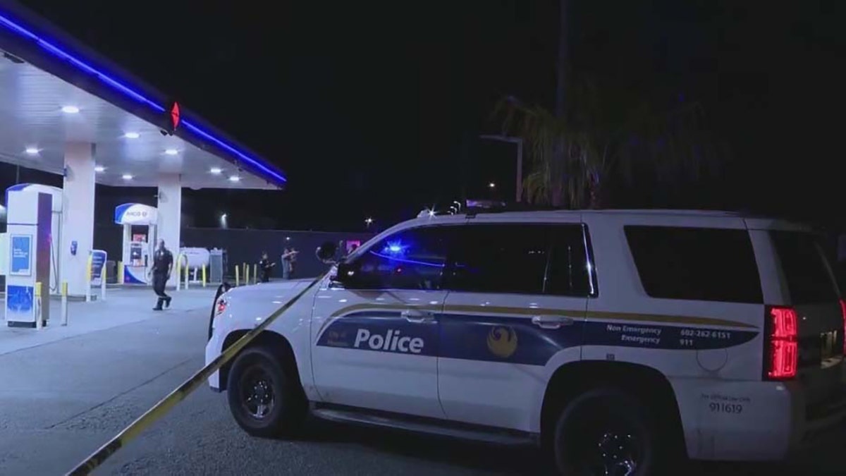 police car outside Arco gas station