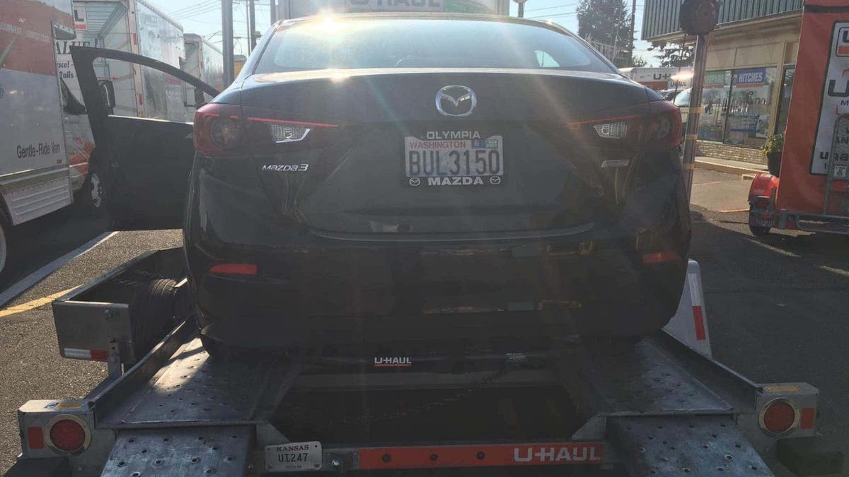 Mazda 3 loaded onto a trailer