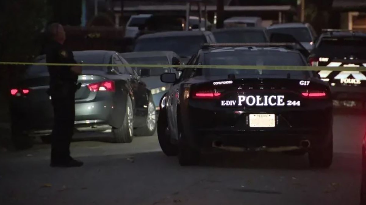 police officer and patrol car at the scene