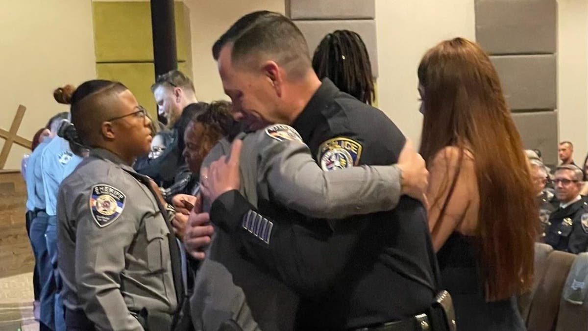 Escondido Sgt. Valdivia and El Paso County Deputy Young hug