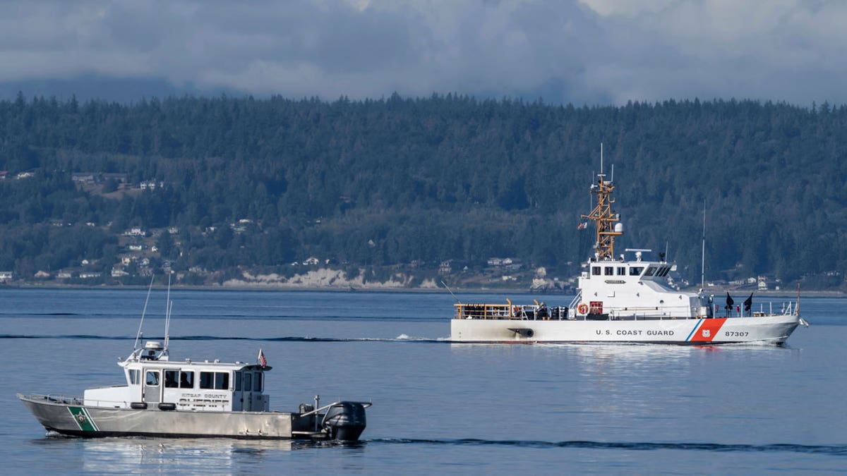 A U.S. Coast Guard boat in Puget Sound, where a seaplane crash has killed ten people.