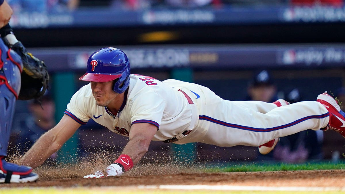 JT Realmuto sliding into home