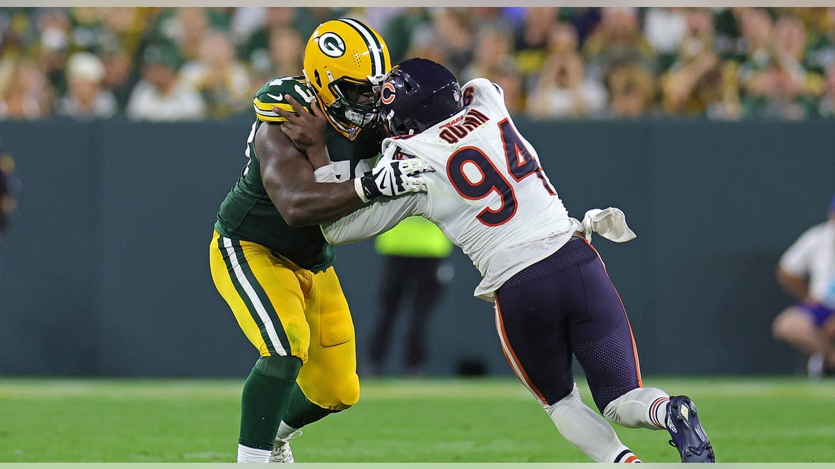 Robert Quinn rushes into lineman