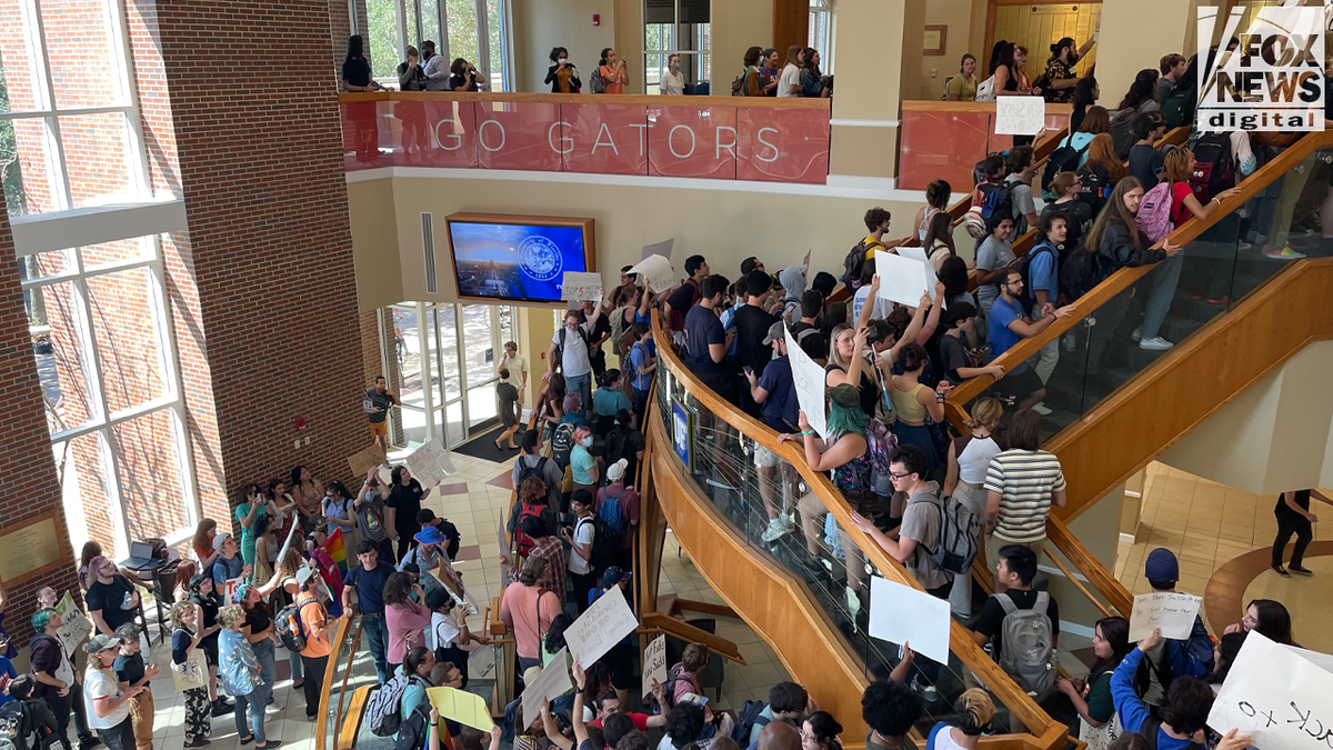 Students protest nomination of Ben Sasse to be University of Florida president.