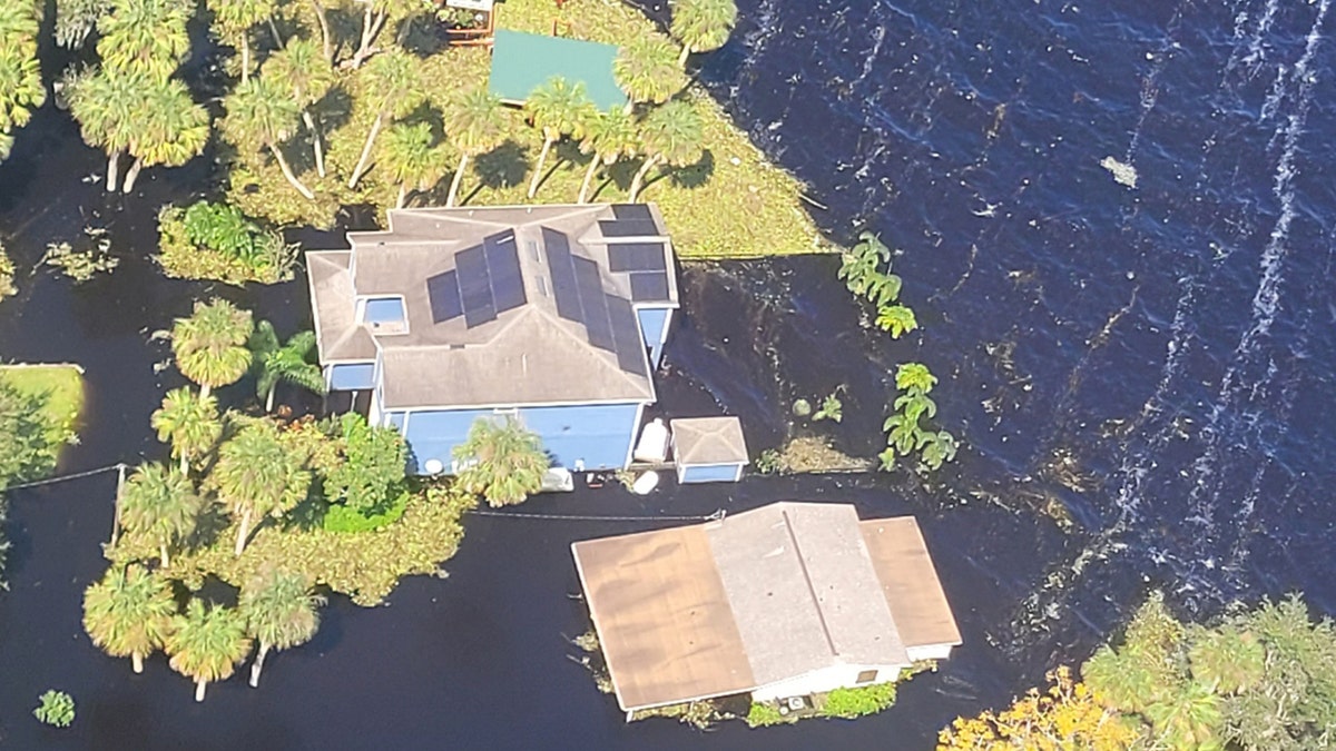 floodwaters surrounding homes