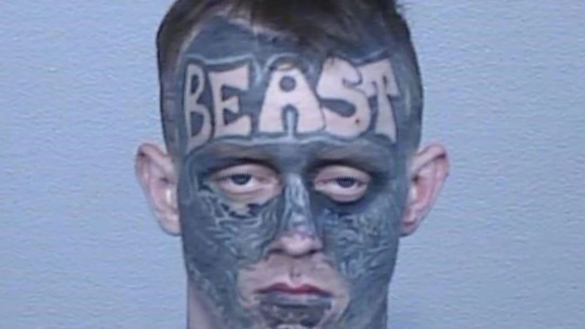 suspect with face tattoo