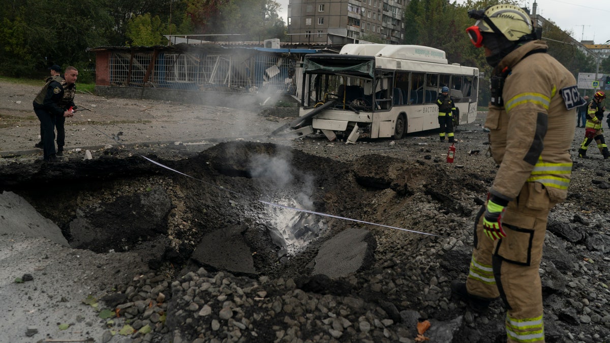 A Russian missile blasts a hole in Kyiv