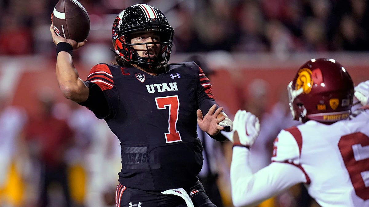 Cameron Rising throwing against USC