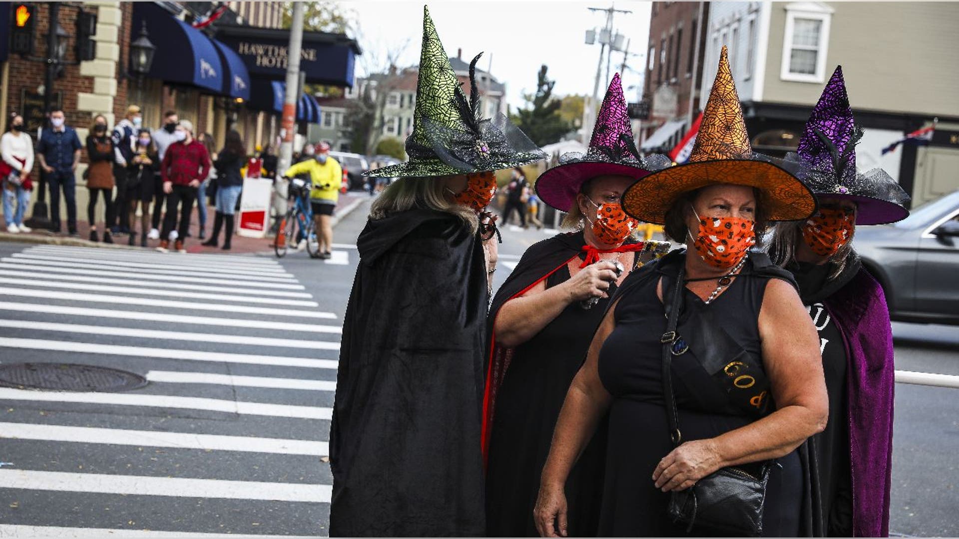 Four women dressed as witches