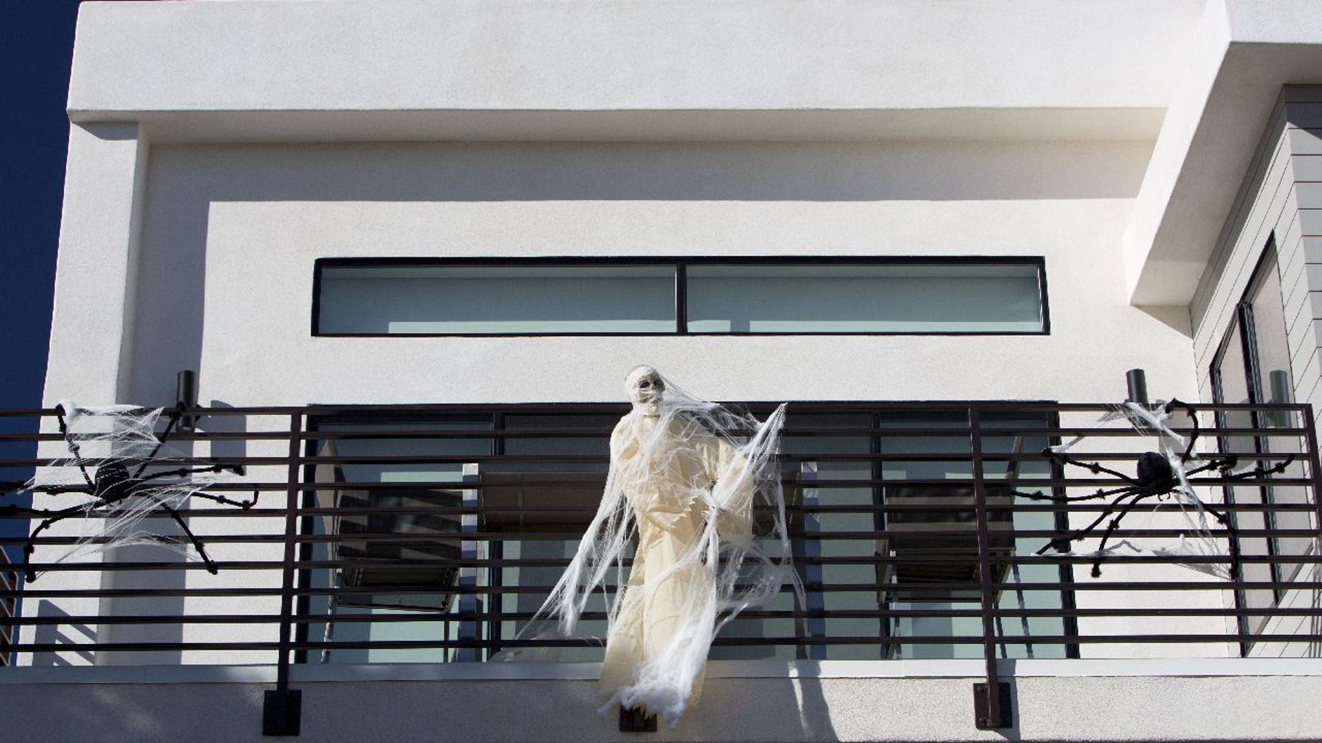 Building terrace with decorative skeleton and spiders