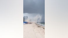 Shocking video shows Florida beach storm throwing umbrellas into the air
