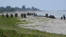 US Marines storm beach near disputed reef in South China Sea joint military drills
