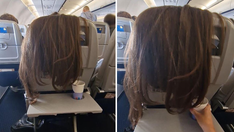 Just 'plane' bad etiquette: Airline passenger drapes her long, thick hair over the back of her seat