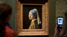 Anti-oil activists target 'Girl with a Pearl Earring' painting with glue, red liquid