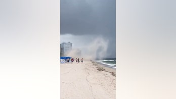 Shocking video shows Florida beach storm throwing umbrellas into the air