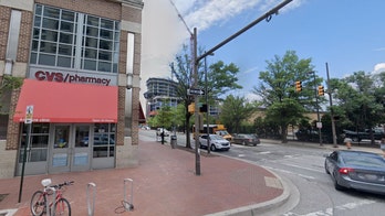 Syringe-wielding Baltimore man accused of theft shot in face by security officer