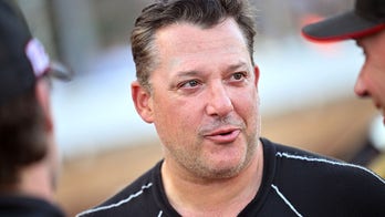 Tony Stewart upset with NASCAR's penalty, 'super glad' he's at NHRA event rather than playoff race