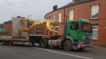 British locals up in arms as naked golden statue retired for the winter