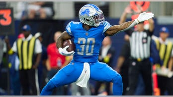 Lions' Jamaal Williams hits referee making penalty call in head with ball