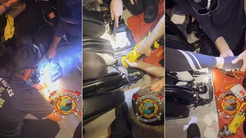 Firefighters free sobbing woman after she's trapped in massage chair: video