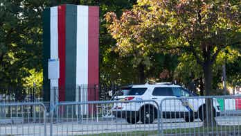 Box covering Christopher Columbus statue in Philly painted colors of Italian flag