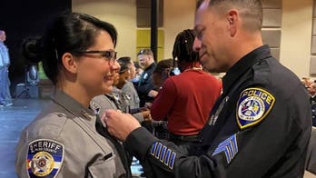 Colorado deputy pinned at graduation ceremony by officer who saved her life decades earlier