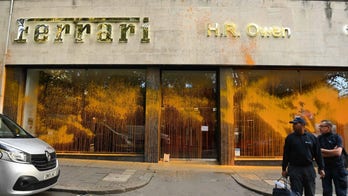 WATCH: Anti-oil protesters in London spray paint storefronts of Bentley, Ferrari, Bugatti dealerships