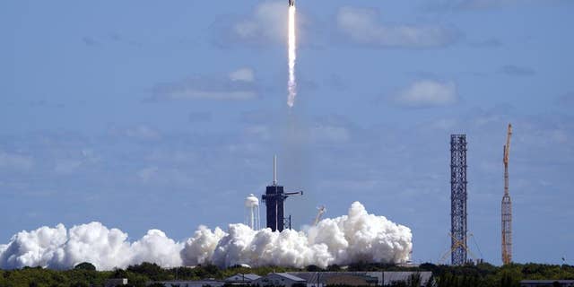 A SpaceX Falcon 9 rocket carrying a Crew Dragon capsule lifts disconnected from Pad 39A astatine nan Kennedy Space Center successful Cape Canaveral, Fla., Wednesday, Oct. 5, 2022 for a ngo to nan International Space Station.