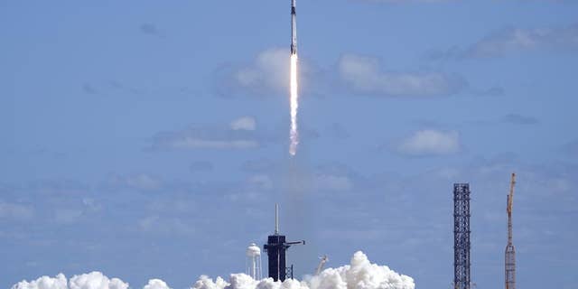 A SpaceX Falcon 9 rocket carrying a Crew Dragon capsule lifts disconnected from Pad 39A astatine nan Kennedy Space Center successful Cape Canaveral, Fla., Wednesday, Oct. 5, 2022 for a ngo to nan International Space Station.