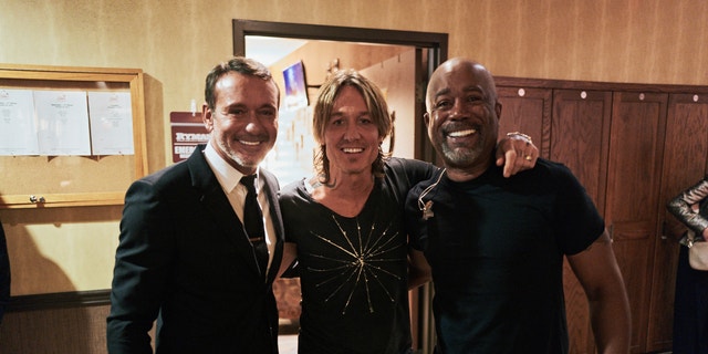 Tim McGraw, Keith Urban and Darius Rucker posed together backstage. Both Urban and Rucker performed songs by Loretta Lynn.