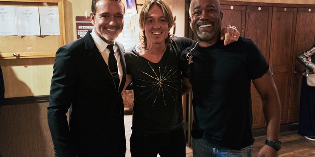 Tim McGraw, Keith Urban and Darius Rucker posed together backstage. Both Urban and Rucker performed songs by Loretta Lynn.