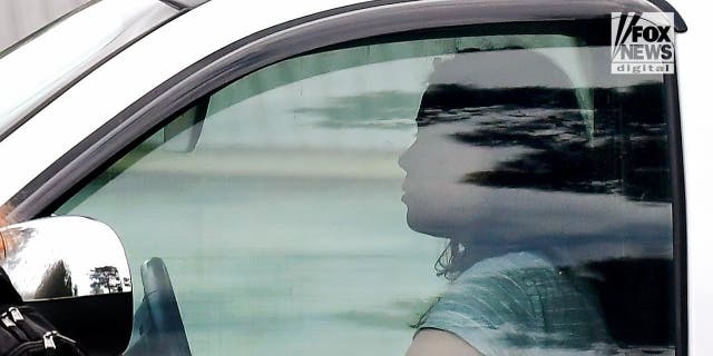 Leilani Simon, the mother of missing Georgia boy Quinton Simon, is spotted leaving the house.