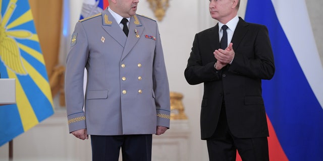 Russian President Vladimir Putin and Colonel General Sergei Surovikin, commander of the Russian forces in Syria, attend a state awards ceremony for military personnel who have served in Syria at the Kremlin in Moscow, Russia on December 28, 2017. 