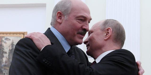 Russian President Vladimir Putin embraces his Belarusian counterpart Alexander Lukashenko during a meeting in Moscow, Russia December 29, 2018.