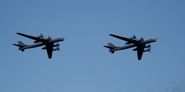 Russian strategic bomber Tupolev Tu-95 flies during a military parade marking Belarus' independence day in Minsk.  A pair of Russian Tu-95 Bear-H bombers were intercepted in flight in international airspace near Alaska.